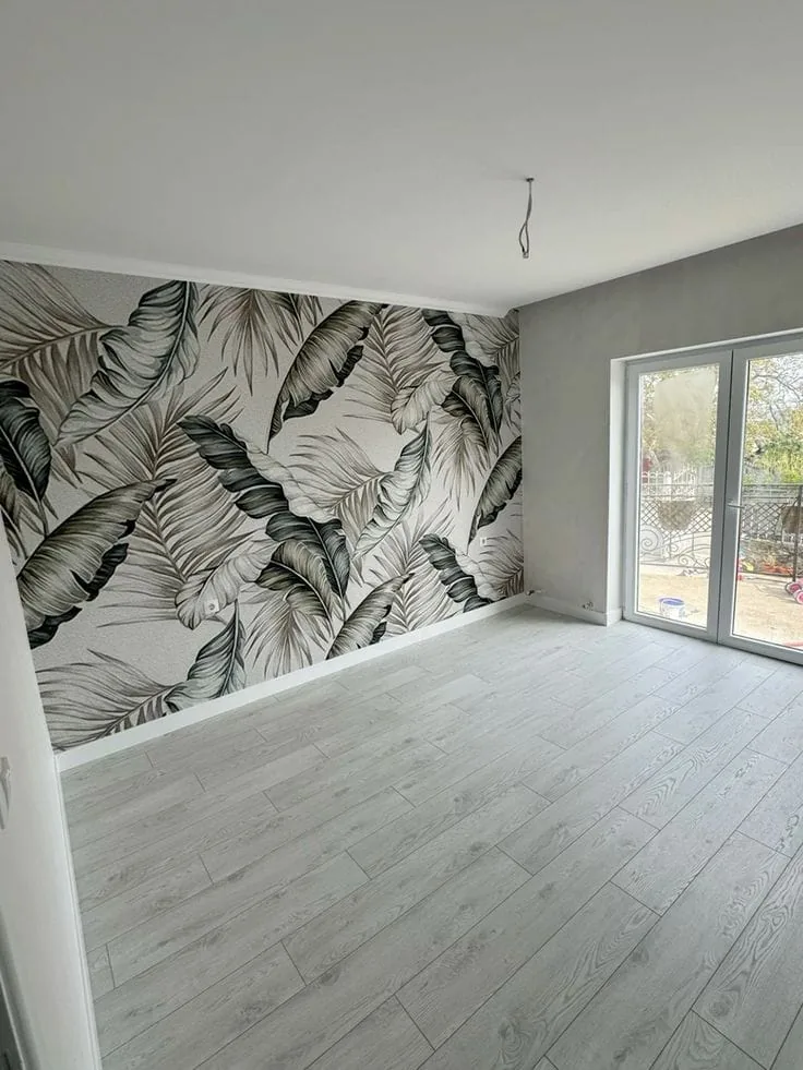 Modern bedroom with tropical leaf wallpaper